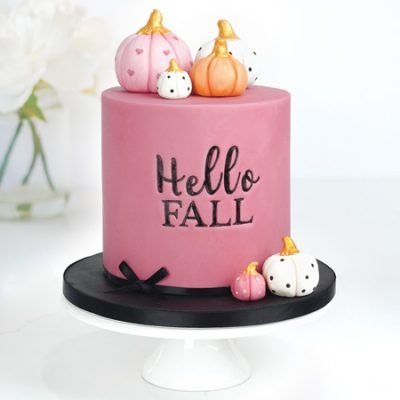 fall inspired cake with personalised lettering and fondant pumpkin cake toppers
