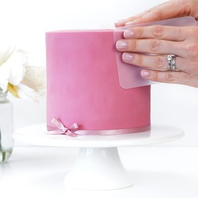 Covering a cake in fondant using the panelling method